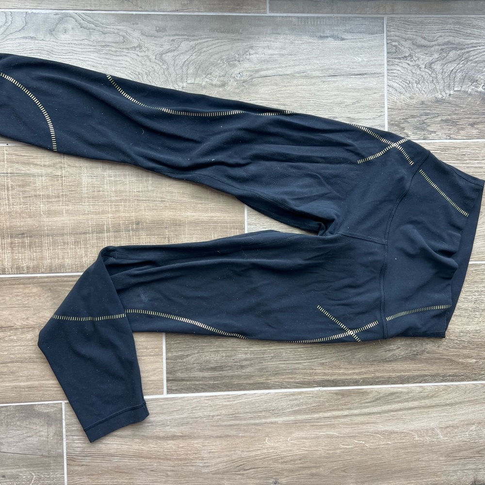 Lululemon Black Leggings with Gold Stitching